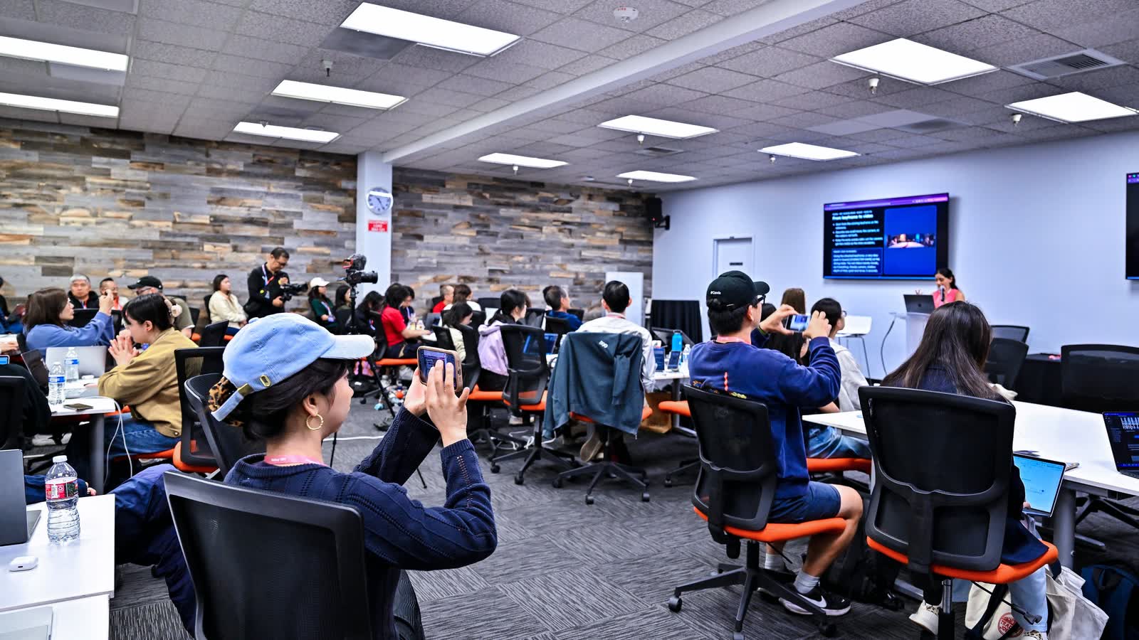 Teams at work on the lab floor, seen from the back of the room